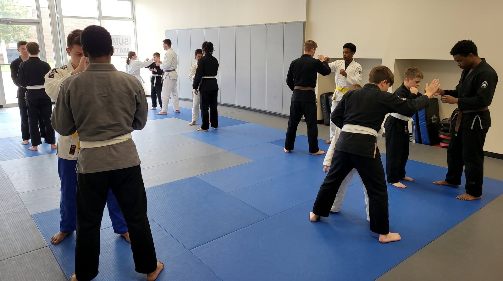 Teens and adults during structured martial arts class